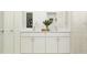 Bathroom with a double sink vanity with white cabinets and chrome fixtures at 11547 E 71St Ter, Palmetto, FL 34221