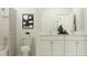 Bright bathroom featuring double vanity, a shower with tiled walls, and neutral decor at 11547 E 71St Ter, Palmetto, FL 34221