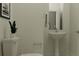 White pedestal sink and toilet in the bathroom at 11547 E 71St Ter, Palmetto, FL 34221