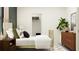 Cozy bedroom featuring a brass bed, ample storage, and minimalist decor at 11547 E 71St Ter, Palmetto, FL 34221