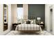 Elegant bedroom with a brass bed frame, neutral bedding, and a geometric patterned rug at 11547 E 71St Ter, Palmetto, FL 34221