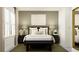 Well-appointed bedroom with a dark wood bed frame, stylish lamps, and decorative accents at 11547 E 71St Ter, Palmetto, FL 34221