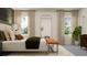 Cozy bedroom with a bed, natural light, and a modern design with a neutral color palette at 11547 E 71St Ter, Palmetto, FL 34221