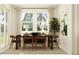 A brightly lit dining room with modern table, natural light, and art at 11547 E 71St Ter, Palmetto, FL 34221
