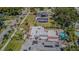 A high-angle aerial view captures the property's large pool and patio, nestled in a beautiful neighborhood at 1175 Jackson Rd, Clearwater, FL 33755