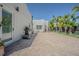 Private backyard featuring an outdoor grill, mature palm trees, and comfortable seating at 1175 Jackson Rd, Clearwater, FL 33755