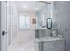 The bathroom is equipped with a glass-enclosed shower and custom countertop at 1175 Jackson Rd, Clearwater, FL 33755