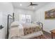 Bedroom features a comfortable bed, bright windows and ceiling fan at 1175 Jackson Rd, Clearwater, FL 33755