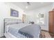 Bright bedroom has an ornate bed frame and lots of natural light at 1175 Jackson Rd, Clearwater, FL 33755