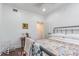 Bedroom with iron bed frame, hardwood floors and vintage decor at 1175 Jackson Rd, Clearwater, FL 33755
