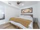 Cozy bedroom with hardwood floors, ceiling fan and comfortable bed at 1175 Jackson Rd, Clearwater, FL 33755