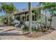 Beautiful home featuring a covered front porch, lush landscaping and a welcoming entrance at 1175 Jackson Rd, Clearwater, FL 33755
