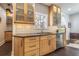 Well-equipped kitchen with modern appliances, light wood cabinetry, and sleek countertops at 1175 Jackson Rd, Clearwater, FL 33755