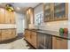 Modern kitchen featuring stainless steel appliances, wooden cabinets, and stylish countertops at 1175 Jackson Rd, Clearwater, FL 33755