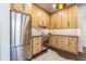 Bright kitchen with light wood cabinetry, modern appliances, and a view to the dining room at 1175 Jackson Rd, Clearwater, FL 33755