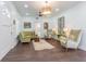 Bright living room with hardwood floors, white walls, an archway, and elegant furnishings, creating a cozy atmosphere at 1175 Jackson Rd, Clearwater, FL 33755