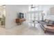 Modern living room featuring contemporary furniture and french doors that provide outdoor access at 1175 Jackson Rd, Clearwater, FL 33755