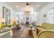 Inviting living room featuring hardwood floors, lots of natural light, and a decorative fireplace at 1175 Jackson Rd, Clearwater, FL 33755