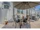 Outdoor patio featuring comfortable seating under a large patio umbrella at 1175 Jackson Rd, Clearwater, FL 33755