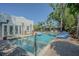 Stunning outdoor pool area with lush landscaping, patio and lounge area at 1175 Jackson Rd, Clearwater, FL 33755