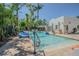 Inviting outdoor pool area with lush landscaping and comfortable seating at 1175 Jackson Rd, Clearwater, FL 33755