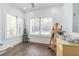 Bright room featuring hardwood floors, plantation shutters, and natural light, ideal as a studio at 1175 Jackson Rd, Clearwater, FL 33755