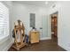 Bright and airy room featuring hardwood floors, a painter's easel, and natural light at 1175 Jackson Rd, Clearwater, FL 33755