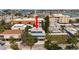 Drone shot shows home's location near shops, restaurants, and waterfront amenities at 118 94Th Ave, Treasure Island, FL 33706