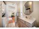Compact bathroom with a sink and vanity with a view into the living room at 118 94Th Ave, Treasure Island, FL 33706