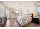 Spacious bedroom with access to a balcony, lots of light, and a ceiling fan at 118 94Th Ave, Treasure Island, FL 33706