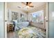 Cozy sunroom with a daybed, ceiling fan, bright rug, and many large windows for natural light at 118 94Th Ave, Treasure Island, FL 33706