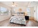 Light-filled bedroom with modern furnishings and laminate wood floors at 118 94Th Ave, Treasure Island, FL 33706