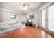 Cozy living room with hardwood floors and a glimpse into the bedroom at 118 94Th Ave, Treasure Island, FL 33706