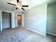 Bedroom featuring neutral walls and carpeting, a ceiling fan, and closet at 11823 Dumaine Valley Rd, Riverview, FL 33579