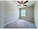 Bedroom featuring neutral walls and carpeting, a ceiling fan, and a window at 11823 Dumaine Valley Rd, Riverview, FL 33579