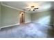 Spacious bedroom featuring a ceiling fan and neutral carpet at 11823 Dumaine Valley Rd, Riverview, FL 33579