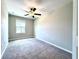 Bedroom featuring neutral walls and carpeting, a ceiling fan, and a window at 11823 Dumaine Valley Rd, Riverview, FL 33579