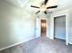 Bedroom featuring neutral walls and carpeting, a ceiling fan, and closet at 11823 Dumaine Valley Rd, Riverview, FL 33579