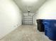 A clean garage with an automatic door, and ample space for parking and additional storage at 11823 Dumaine Valley Rd, Riverview, FL 33579