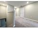 Upstairs hallway with neutral carpet, and paint, plus white trim and recessed lighting at 11823 Dumaine Valley Rd, Riverview, FL 33579