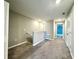 Upstairs hallway with neutral carpet, and paint, plus white trim and recessed lighting at 11823 Dumaine Valley Rd, Riverview, FL 33579