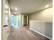 Hallway with carpet, neutral paint, white trim, and multiple rooms branching off at 11823 Dumaine Valley Rd, Riverview, FL 33579