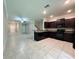 Open kitchen featuring dark cabinets and stainless steel appliances at 11823 Dumaine Valley Rd, Riverview, FL 33579