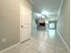 Inviting living room featuring neutral paint and tile flooring throughout at 11823 Dumaine Valley Rd, Riverview, FL 33579