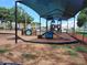 A community playground with a canopy provides a shaded place for play at 11823 Dumaine Valley Rd, Riverview, FL 33579