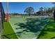 A community tennis court surrounded by green space is shown at 11823 Dumaine Valley Rd, Riverview, FL 33579