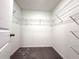 Walk-in closet includes a hanging rack system for organization at 11823 Dumaine Valley Rd, Riverview, FL 33579