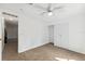 Bedroom featuring carpet flooring, a ceiling fan, a built-in closet, and white walls at 12430 Oconee Blvd, New Port Richey, FL 34654
