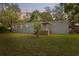 Inviting single-story home with a covered front porch and lush green lawn at 12430 Oconee Blvd, New Port Richey, FL 34654