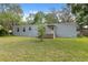 Charming single-story home with a cozy porch and ample outdoor space at 12430 Oconee Blvd, New Port Richey, FL 34654